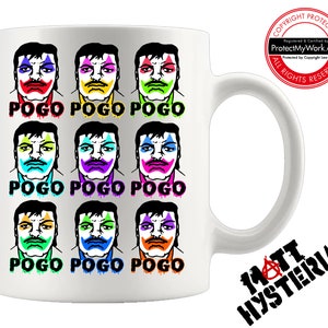 May include: White ceramic mug with a colorful design of nine clown faces and the text "POGO" repeated three times. The mug has a black handle and a black logo on the bottom that says "MATT HYSTERIA".