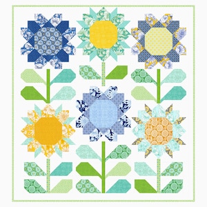 May include: A patchwork quilt with nine flower motifs. The flowers have yellow or orange centres and petals in blue, green, and yellow. Green stems and leaves are set against a white backdrop, with a green border.