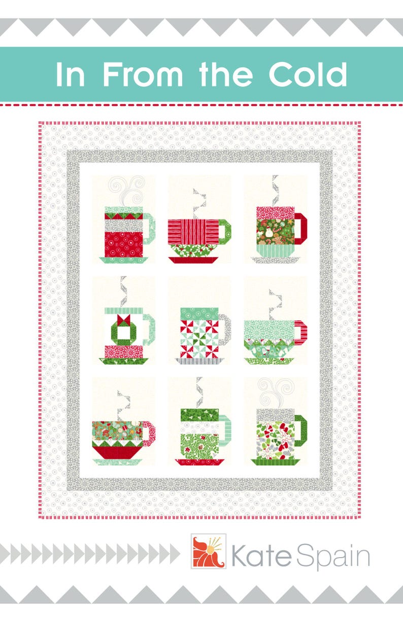 May include: A quilt pattern featuring nine colorful mugs with steam rising from them. The quilt is surrounded by a white border with a gray and white patterned border. The text "In From the Cold" is at the top of the quilt and the text "Kate Spain" is at the bottom.