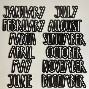 May include: Twelve black and white month labels with white text on a black background. The months are January, February, March, April, May, June, July, August, September, October, November, and December.