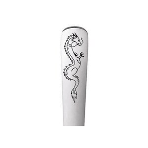 May include: A silver spoon with a black dragon design etched on the handle.