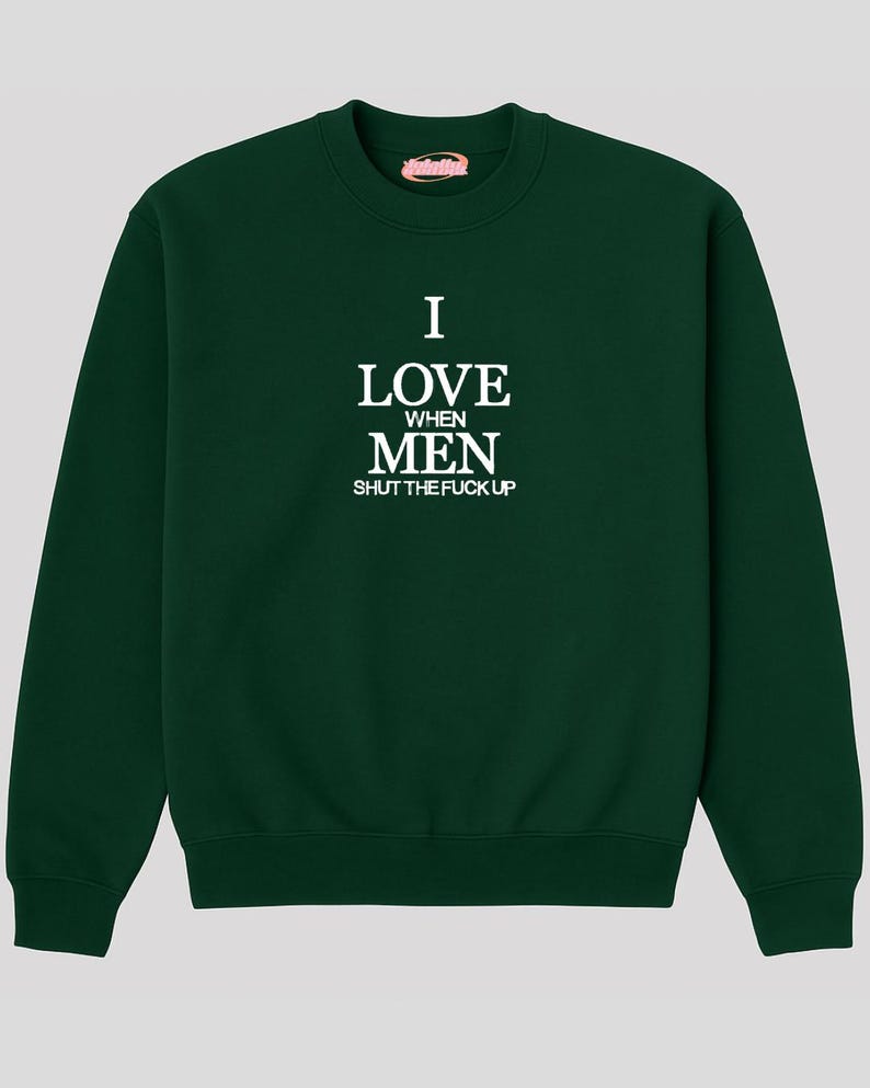 A dark green sweatshirt with white text printed on it.