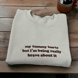 My Tummy Hurts But I'm Being Really Brave About It Embroidered Unisex T-Shirt or Sweatshirt