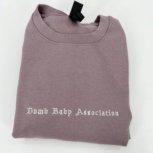 Dumb Baby Association Unisex Embroidered T-Shirt or Crewneck  Sweatshirt