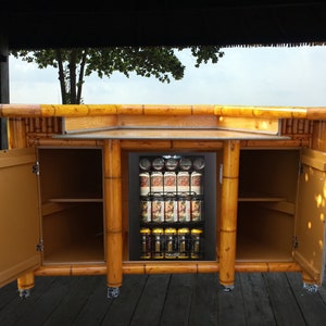 Mini fridge/wine cooler bamboo tiki bar. Outdoor backyard deck, patio, tiki hut or basement bar with storage cabinets, electrical, wheels.