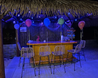 Large bamboo tiki bar with wheels, storage, electrical outlet, footrail. Mini fridge, wine cooler ready backyard patio tiki hut palapa bar.