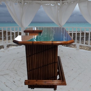Balcony bar, bamboo tiki bar, ocean waves epoxy bar top. Customizable outdoor patio bar. Drink counter, storage cabinets footrail & wheels.