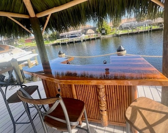 Bamboo tiki bar with stone & epoxy inlay River table bar tops, lights, tiki masks, storage cabinets, drawers, built in cooler. Customizable.