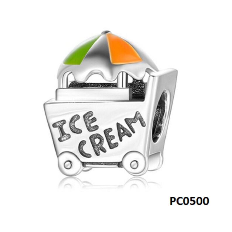 May include: Silver charm shaped like an ice cream cart with a green and orange striped umbrella. The cart has wheels and says "ICE CREAM" on the side.