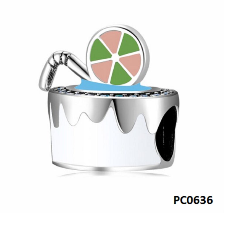 May include: Silver charm with a white and blue enamel design of a glass with a lime wedge and a straw. The charm has a small hole for attaching to a bracelet or necklace. PC0636