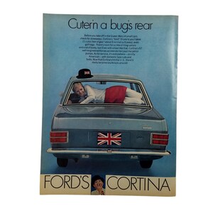 May include: A vintage advertisement for the Ford Cortina car. The ad features a woman lying in the back of a blue Ford Cortina with a Union Jack flag on the back. The text reads "Cutern a bug's rear" and "FORD'S CORTINA".