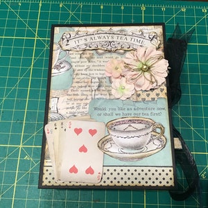Chipboard photo album made with “It’s Always Tea Time” (Alice and wonderland) paper.