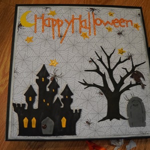 Chipboard photo album made with “Happy Halloween” paper
