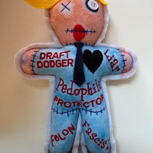 Orange face poppet voodoo doll pincushion