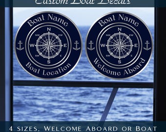 May include: Two blue and silver round vinyl boat decals with a compass and anchor design. One decal says "Boat Name" and "Boat Location". The other decal says "Boat Name" and "Welcome Aboard".