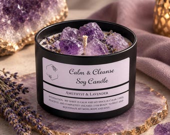 May include: A black cylindrical soy candle topped with raw purple amethyst crystals and dried lavender. The white label reads Calm & Cleanse Soy Candle, Amethyst & Lavender, and includes an affirmation about feeling peaceful and relaxed.