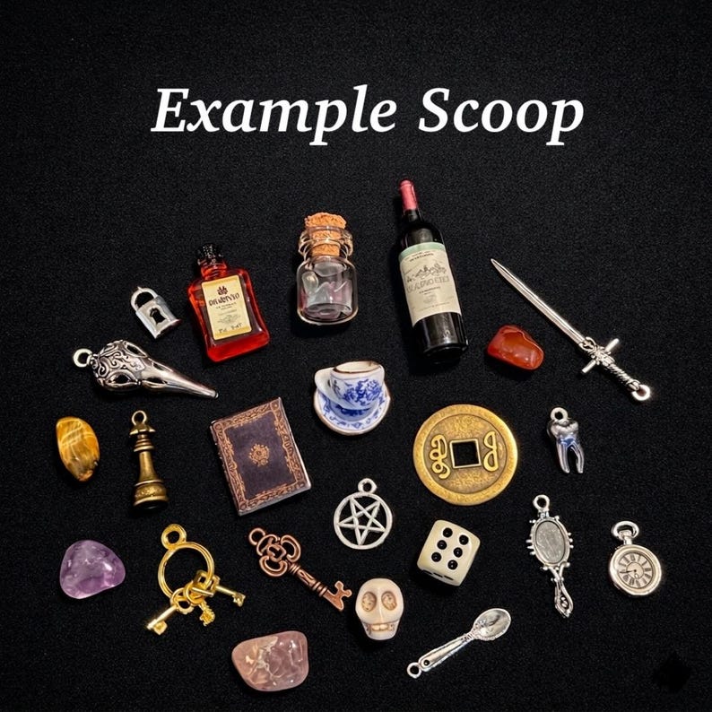 May include: A collection of miniature charms and trinkets, including a wine bottle, a teacup, a book, a skull, a key, a die, and a sword. The text "Example Scoop" is at the top of the image.