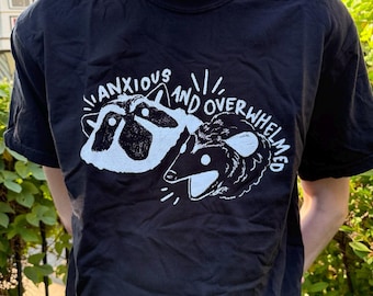 Anxious and Overwhelmed Raccoon and Possum T-shirt: Screen-printed Cotton Unisex Tee
