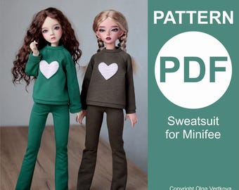 May include: Two dolls in matching green and brown sweat suits, each with a white heart. The image includes the text "PATTERN PDF Sweatsuit for Minifee". Copyright Olga Vertkova is also displayed.
