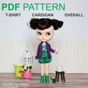 May include: PDF pattern for a doll outfit, including a green overall, purple striped cardigan, and a t-shirt. The doll is holding gardening shears and a watering can. The text on the image reads "PDF PATTERN T-SHIRT CARDIGAN OVERALL".