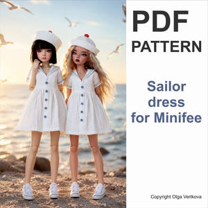 May include: Two dolls wearing white sailor dresses with blue buttons and matching sailor hats with red pom-poms. The dolls have white sneakers and are standing on a beach. The text reads PDF PATTERN Sailor dress for Minifee Copyright Olga Vertkova.