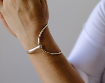 Wide hinged bracelet in sterling silver, handmade in Midcentury modernist style featuring round karma element, great Mother’s Day gift