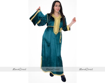 May include: A long, teal velvet dress with gold embroidery and a matching belt. The dress has long sleeves and a V-neckline.