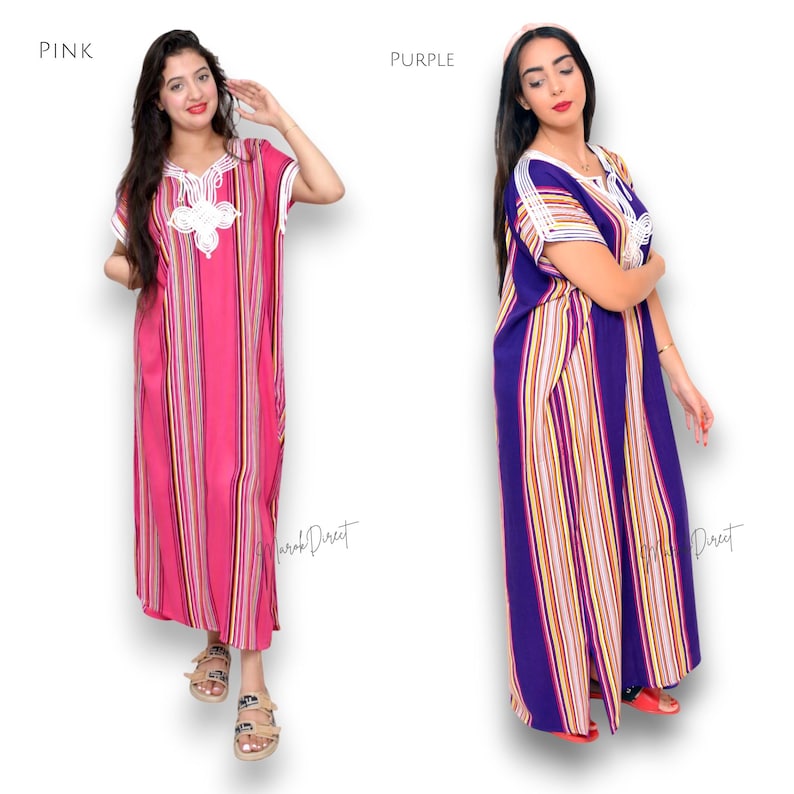 May include: Two floor-length kaftan dresses, one in pink and one in purple, both featuring vertical multi-colored stripes, short sleeves, and a white embroidered V-neckline detail. The text "PINK" and "PURPLE" labels the respective garments.