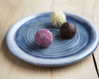 small hand-turned dessert ceramic plate in a modern design for muffins, chocolates, or as a storage plate,