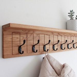 Wall-mounted oak organizer with hooks, Wooden coat hanger with metal hooks, Сoat rack with shelf