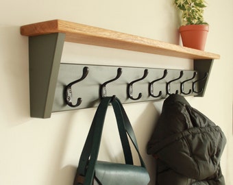 Wood coat rack in green gray with metal hooks and a oak shelf, perfect for entryways, hallways, or mudrooms