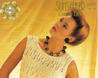 May include: A white crocheted sleeveless top with a black belt. The top has a delicate openwork pattern. The model is wearing a necklace with black beads and gold accents.