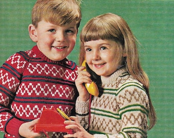 May include: Two children wearing colorful knitted sweaters. The boy is holding a red toy telephone. The girl is holding a yellow toy telephone. The background is green. The text on the image reads "22-26" 1776-9d PLEASURE D.K. DOUBLE CREPE LAINE  BAIRNSWEAR"