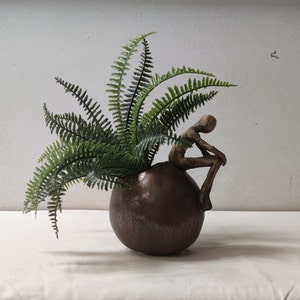 Ceramic ball with man