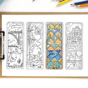 May include: Four rectangular bookmarks featuring intricate line art illustrations. Three are black and white, depicting a bridge with a fish, a beach scene with a lighthouse, and a cityscape with laundry. One is coloured with a blue and yellow diamond pattern.