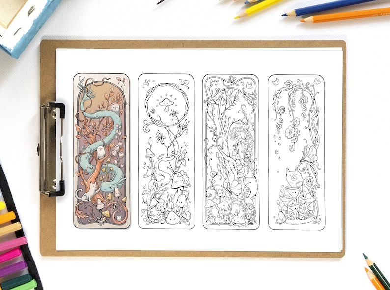 May include: Four illustrated bookmarks with whimsical designs featuring a dragon, mushrooms, and floral elements. The bookmarks are black and white line drawings with a fantasy theme, displayed on a clipboard with colored pencils.