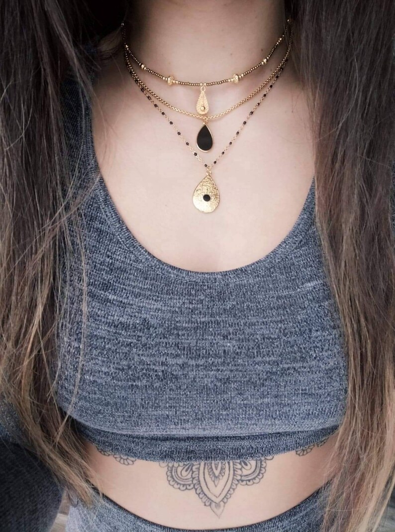 Black beaded chain necklace and baroque charm