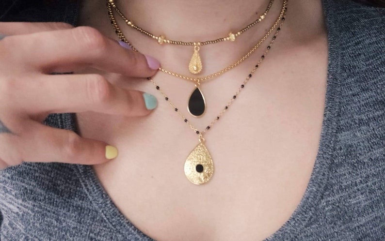 Black beaded chain necklace and baroque charm