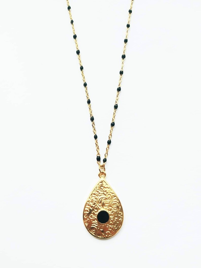 Black beaded chain necklace and baroque charm