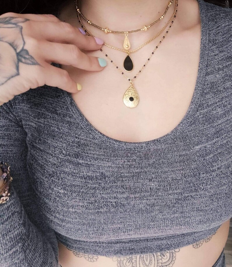 Black beaded chain necklace and baroque charm