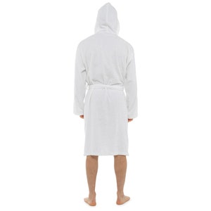May include: A white hooded bathrobe with a self-tie belt. The robe is made of a soft, absorbent material.