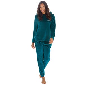 May include: A teal blue velour hooded sweatshirt and matching sweatpants set. The sweatshirt has a drawstring hood and the text "Ava" embroidered on the front.