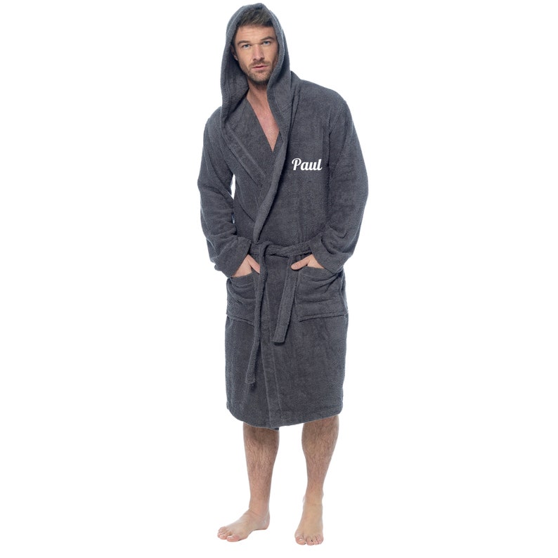 May include: A gray hooded robe with a white embroidered name "Paul" on the left side of the chest.