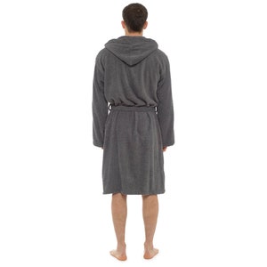 May include: A gray hooded robe with a tie belt. The robe is made of a soft, absorbent material.