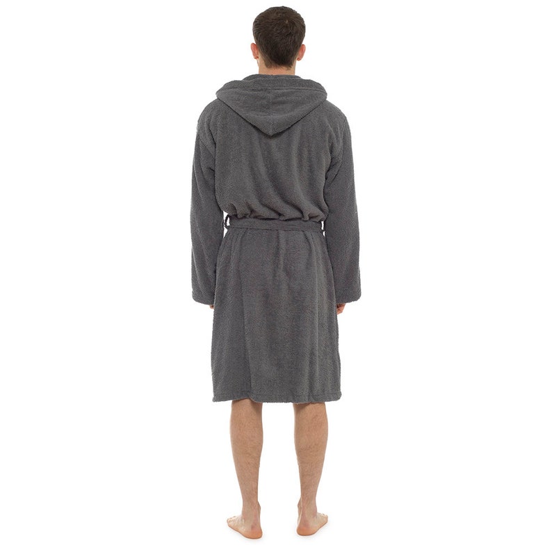 May include: A gray hooded robe with a tie belt. The robe is made of a soft, absorbent material.