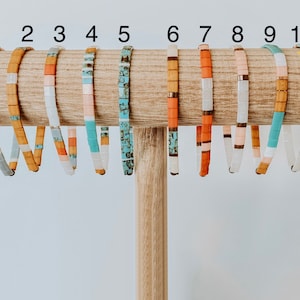 Tila bead bracelets made of colorful square glass beads and elastic.