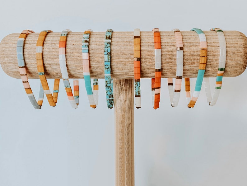 Tila bead bracelets made of colorful square glass beads and elastic.