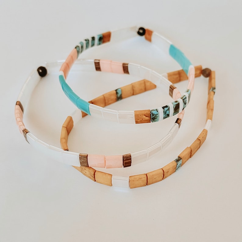 Stack of 3 Tila bead bracelets made of colorful square glass beads and elastic.