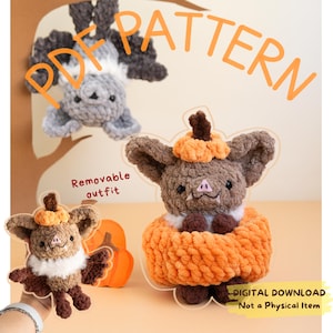 May include: A crochet PDF pattern featuring a brown bat plush with a removable orange pumpkin outfit and a small pumpkin hat. The text reads PDF PATTERN, Removable outfit, and DIGITAL DOWNLOAD Not a Physical Item.