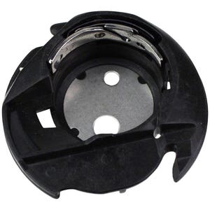 May include: Black plastic bobbin winder for a sewing machine. The winder has a metal hook and a metal plate with two holes.